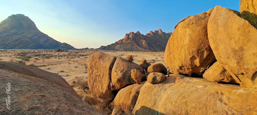 Golden granite boulders and jagged peaks at sunset, Namibia